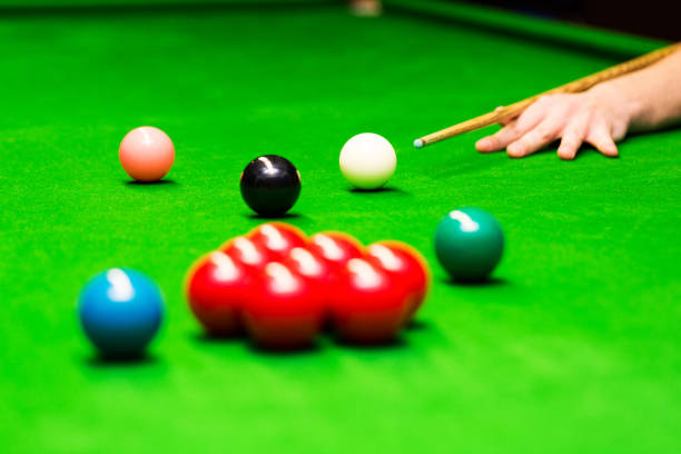 istock snooker - hand aiming the cue ball 645107526