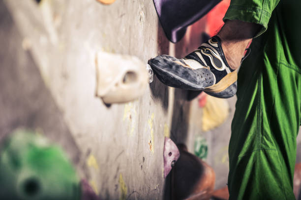 istock male foot on climbing wall 645111368
