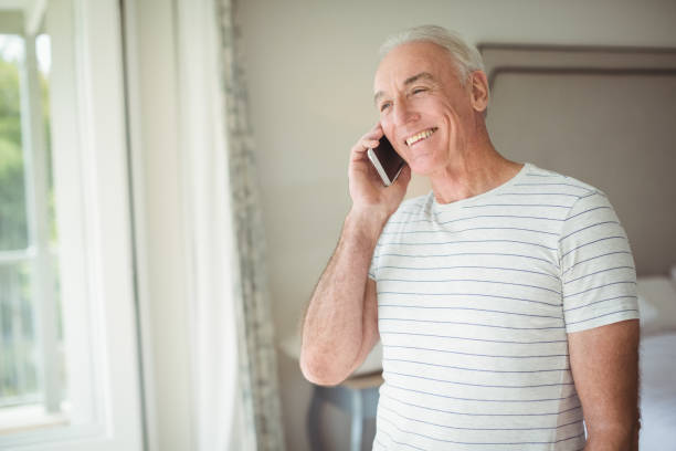istock Happy senior man talking on mobile phone 645117394