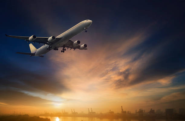 istock passenger plane flying on beautiful  dusky sky 645122128