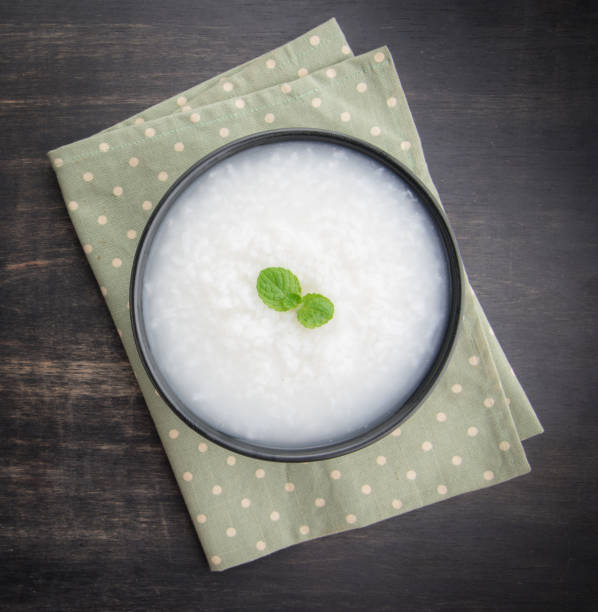 istock Mush or boiled rice in bowl on wooden table 645128840