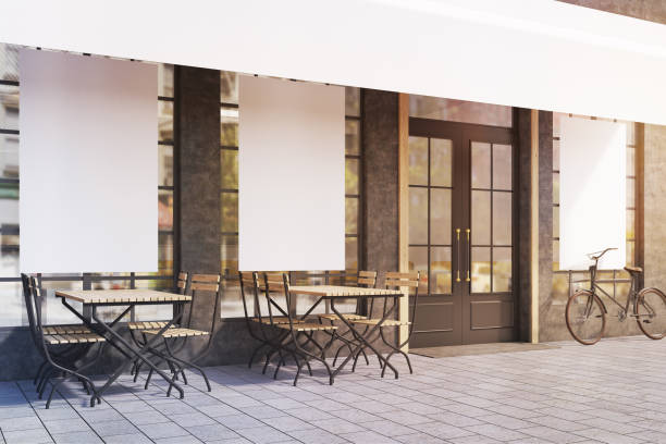 istock Side view of cafe windows with posters, toned 645130002