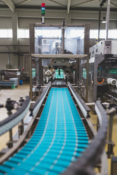 istock Water bottling factory interiors and machinery. 645149830