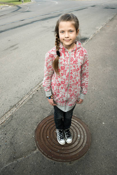 istock urban girl on hatch 645150720