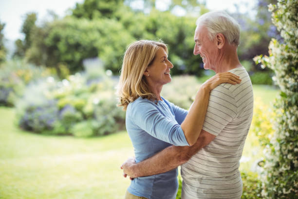 istock Senior couple embracing outdoors 645160464