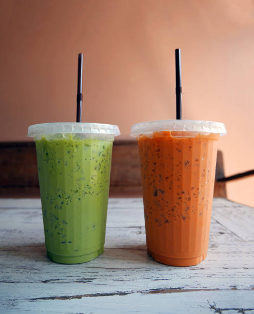 istock Iced cold green tea and orange milk tea 645160510