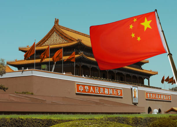chinese flag with beijing imperial palace - communisme stockfoto's en -beelden