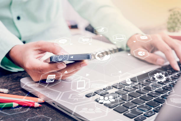 istock businessman working on office table with smart phone 645165532