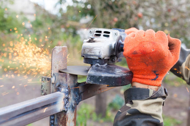 istock Closeup of man using a grinder with cutoff blade 645173424
