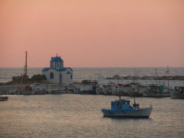 Gialiskari, Ikaria island, Greece the fishing harbor in Gialiskari at sunset, Ikaria island, Greece ikaria island stock pictures, royalty-free photos & images