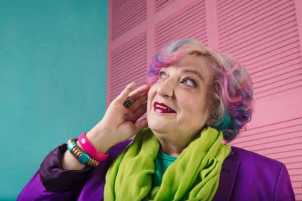 istock Surprised retired happy woman looking up left 645179508