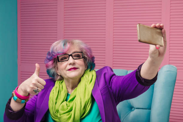 istock Stylish senior woman using smart phone 645180026