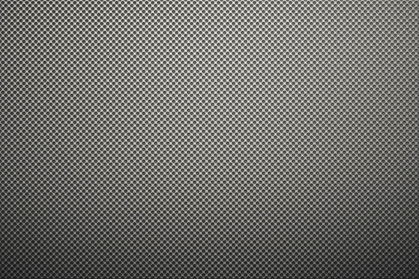 istock metal plate with many small circular holes. 645192294
