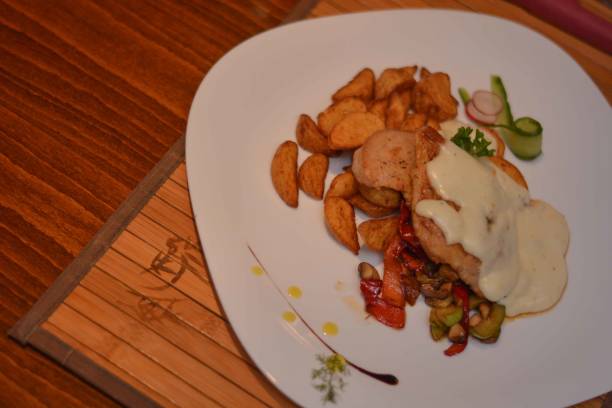 istock Grilled Chicken With Potatoes And Cheese Sauce 645193180