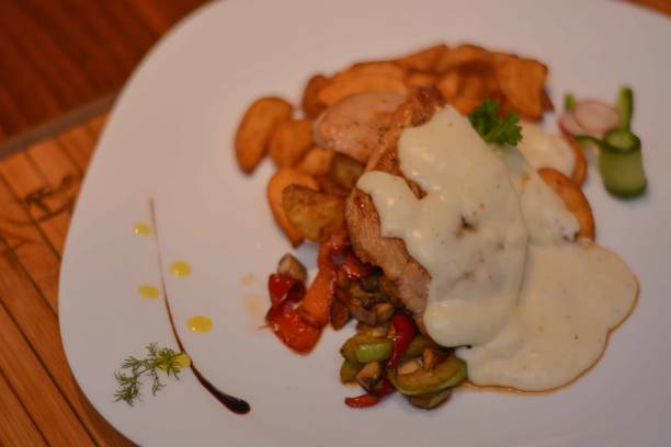 istock Grilled Chicken With Potatoes And Cheese Sauce 645193218