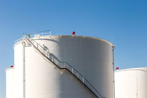 istock white tanks in tank farm with iron staircase 645193400