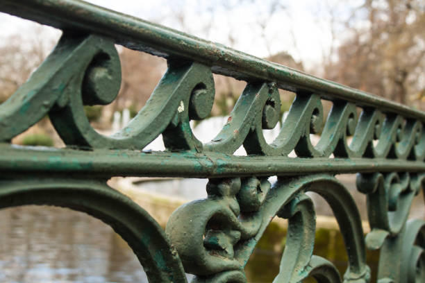 istock public park molten iron railing close up 645193760
