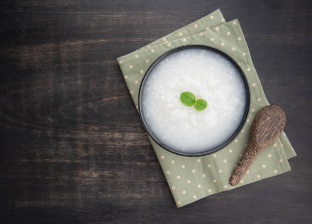 istock Mush or boiled rice in bowl on wooden table 645195930