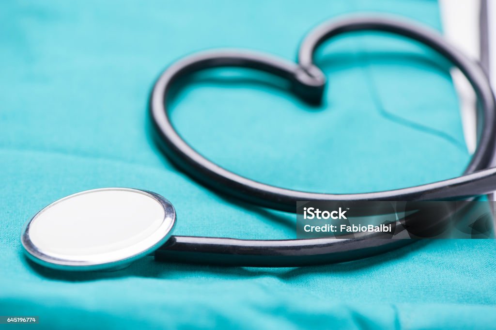 Stethoscope A stethoscope shaping a heart and a clipboard on a medical uniform Blank Stock Photo