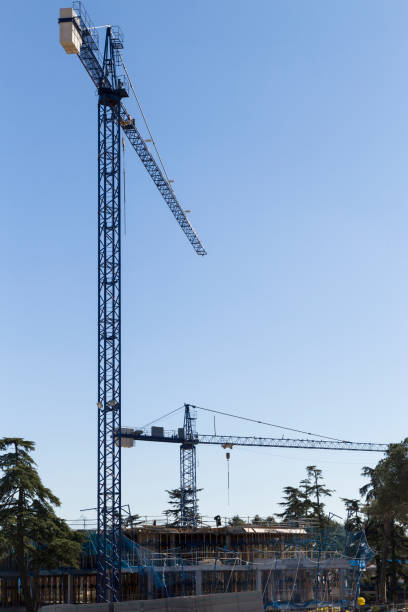 istock blue crane ina a building construction on a sunny day in madrid 645200840