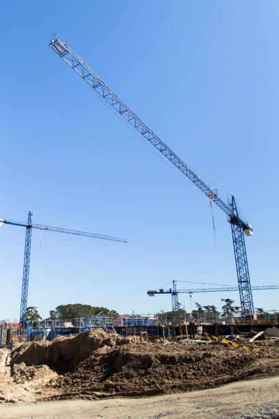 istock blue crane ina a building construction on a sunny day in madrid 645200842