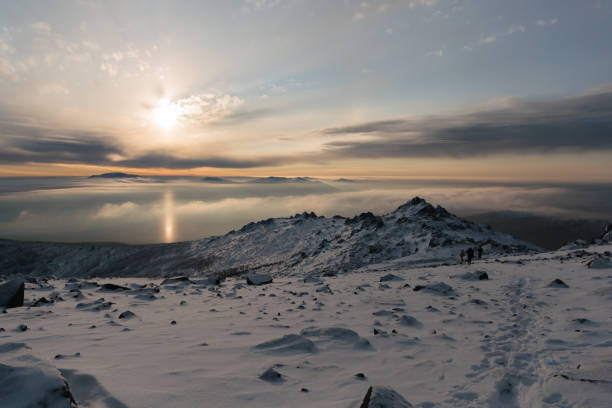 istock winter sunset over a mountain with beautiful clouds 645203808