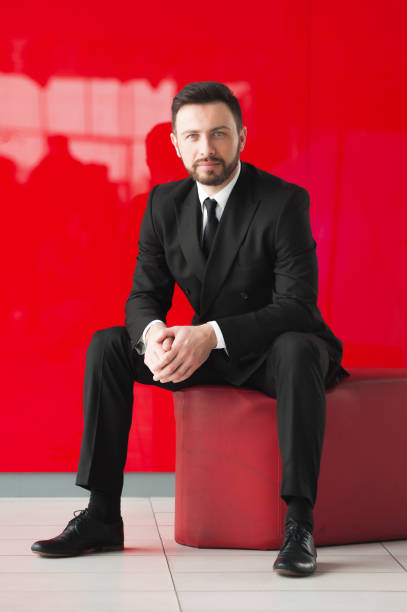 istock Portrait of man, red background. 645210568