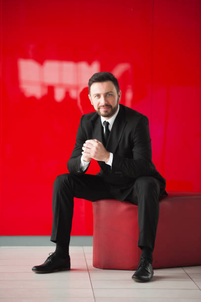 istock Portrait of man, red background. 645210612