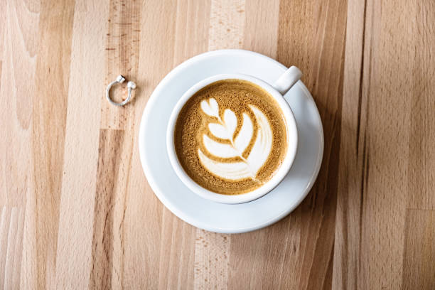 istock Flat lay white mug of cappuccino on a wooden table 645211658