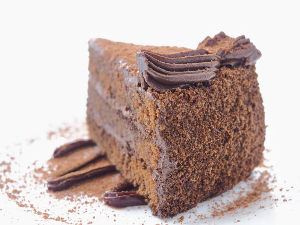 Food background. Piece of chocolate cake isolated on white. stock photo