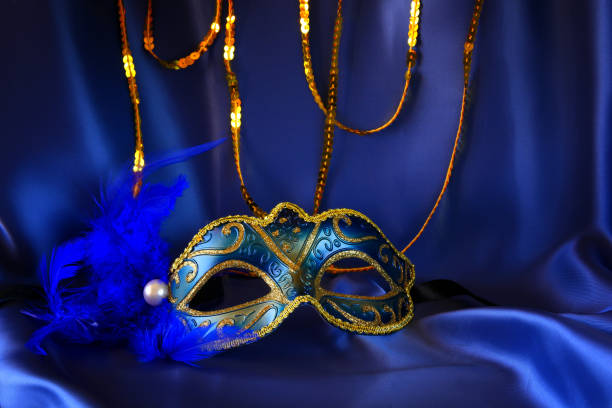 istock elegant venetian mask on blue silk background 645215084