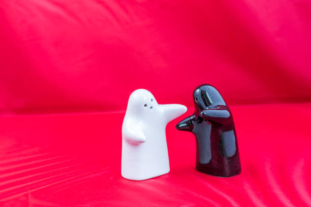 Beautiful and funny salt and pepper shakers on a red background