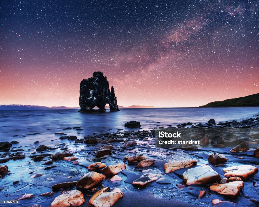 Hvitserkur 15 m height. Fantastic starry sky Hvitserkur 15 m height. Fantastic starry sky and the Milky Way on the east coast of the peninsula Vatnsnes in the north of Iceland. Arch - Architectural Feature Stock Photo
