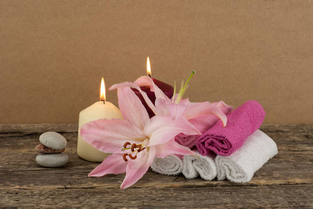 istock Composition with two candles and pink lily 645230874