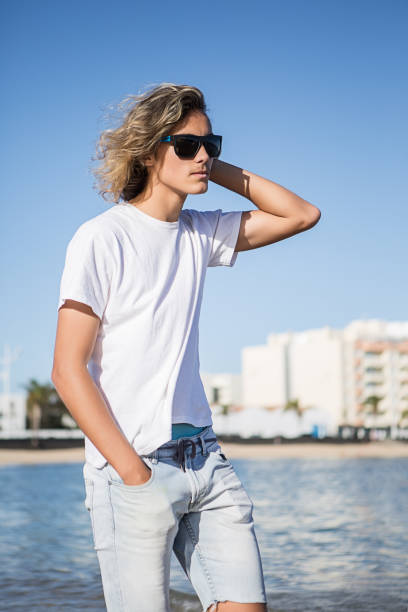 istock Man at sea adjusting hair 645239456