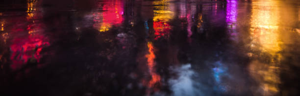 istock NYC streets after rain with reflections on wet asphalt 645240286