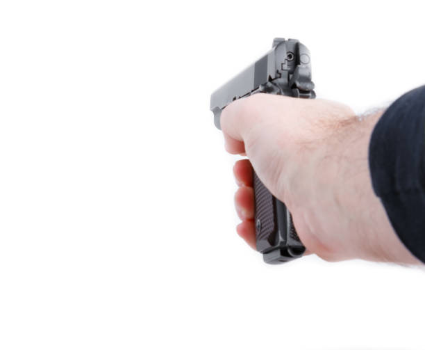 istock Hand holding pistol handgun isolated on white background 645243456