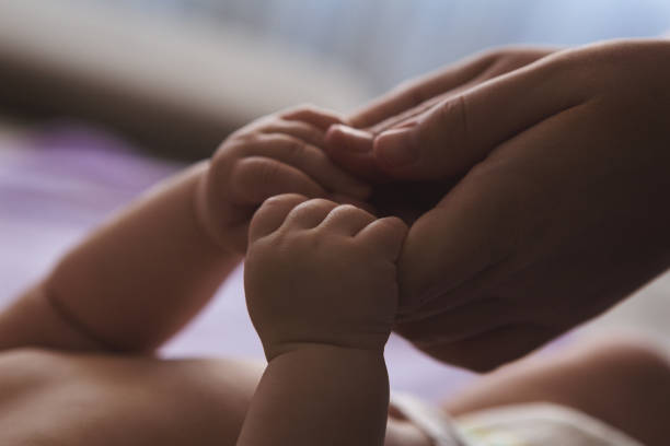 istock Mother and baby hands 645246166