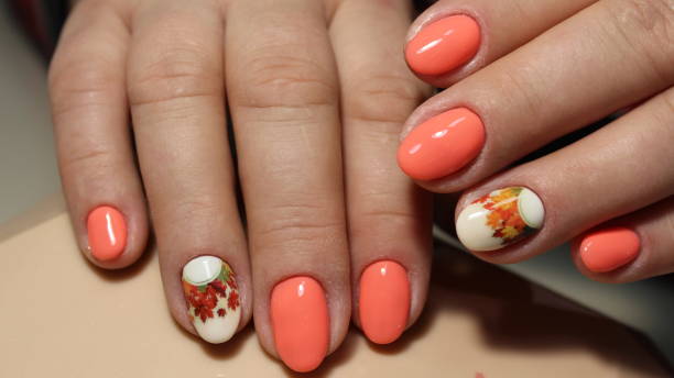 istock Spring manicure, peach, yellow leaves 645250970