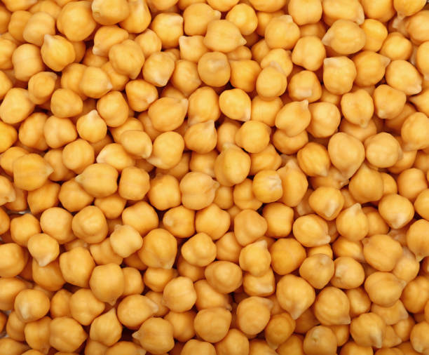 istock Cooked soaked chickpea beans close up background 645260718