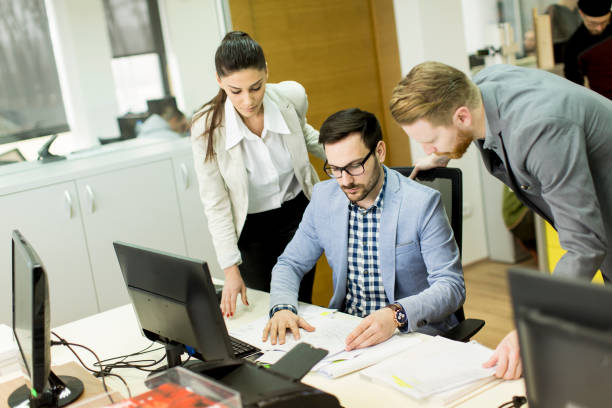 istock Group ofyoung business people at office 645261298