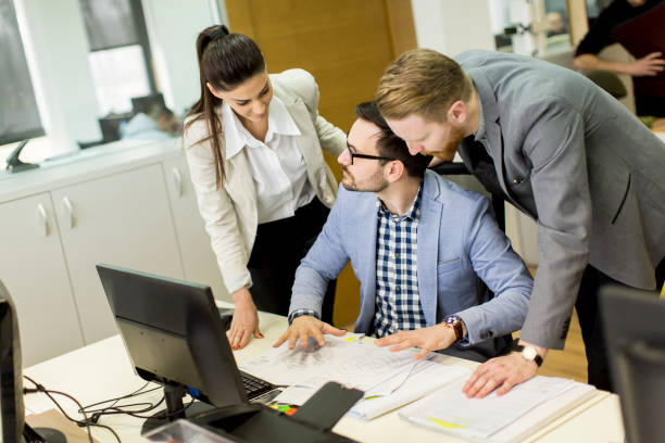 istock Group ofyoung business people at office 645261320