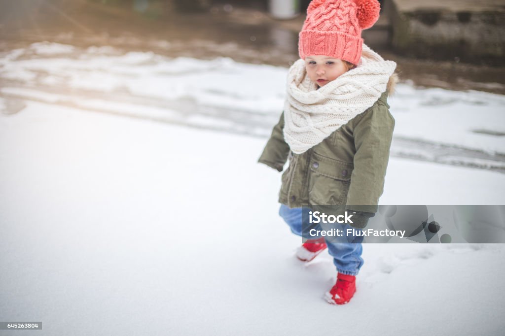 Cute Baby Girl Walking On Snow Stock Photo - Download Image Now - 18-23  Months, Arts Culture and Entertainment, Babies Only - iStock
