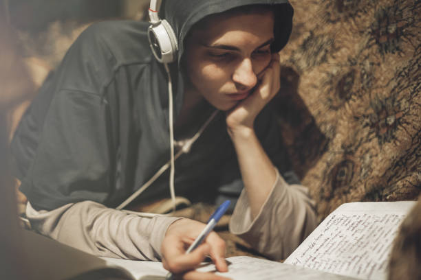 Teenage student studying at home stock photo