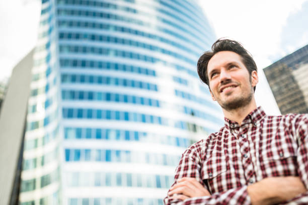 istock casual businessman with arm crossed 645264736