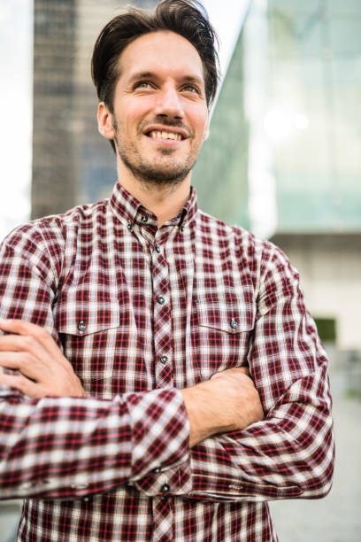 istock casual businessman with arm crossed 645264894