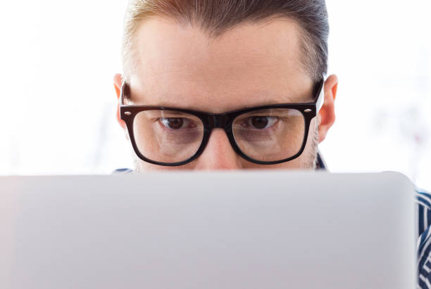 istock Close-up of eyes, man working on a laptop 645276140