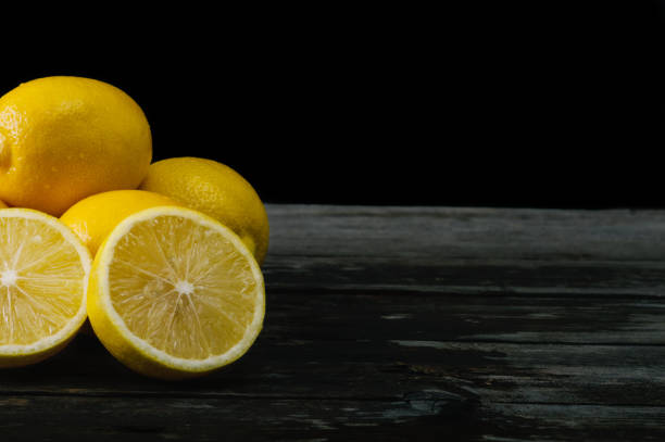 istock Fresh lemons on an old wooden table. 645276672