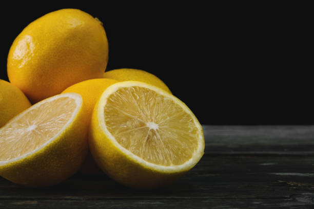 istock Fresh lemons on an old wooden table. 645276790