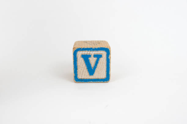 The Letter V in Colorful Wooden Childrenâs Blocks stock photo